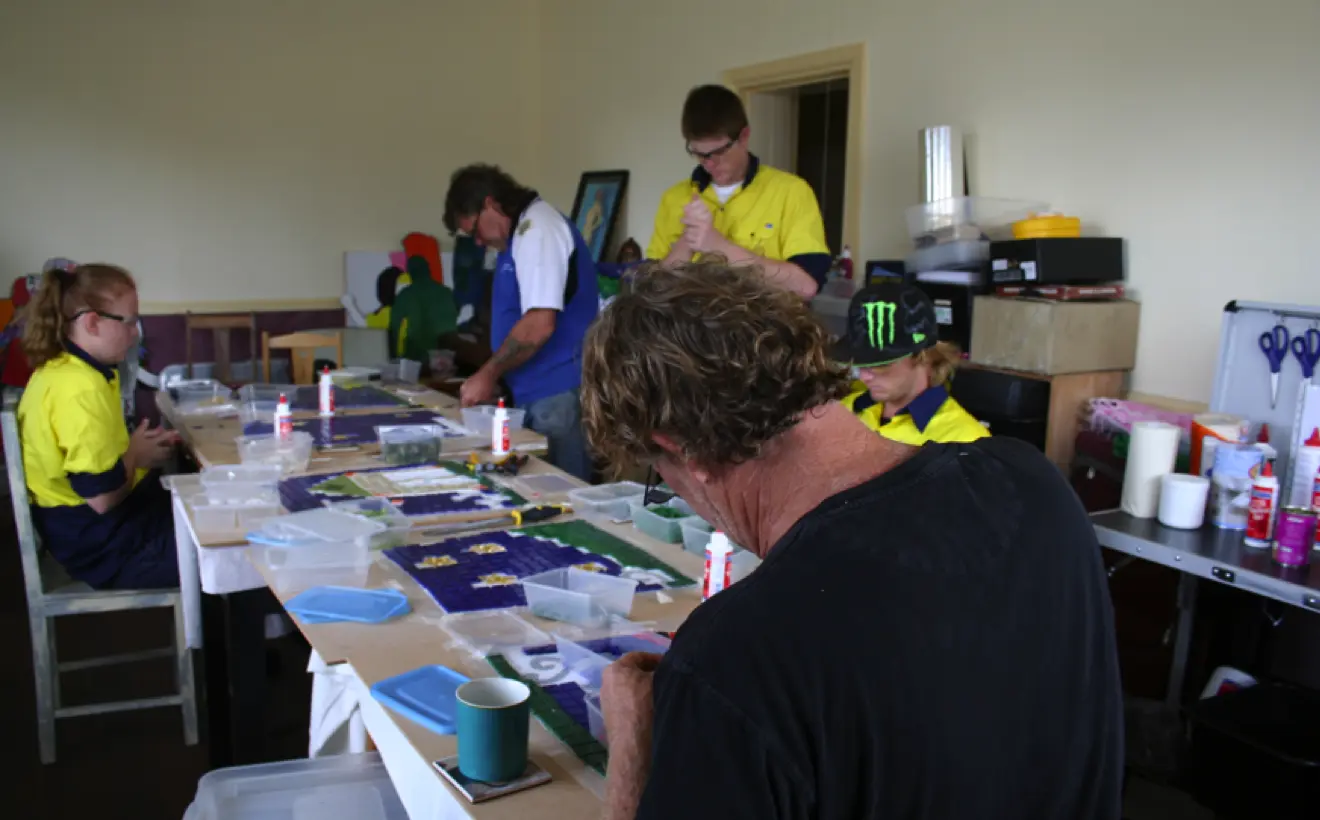 The staff and clients of Northnet working on Snakes and Ladders