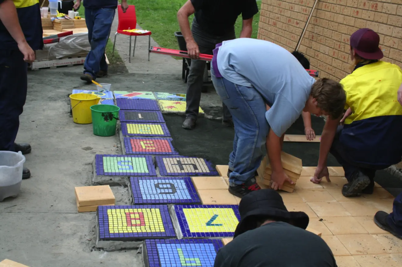 The staff and clients of Northnet working on Snakes and Ladders